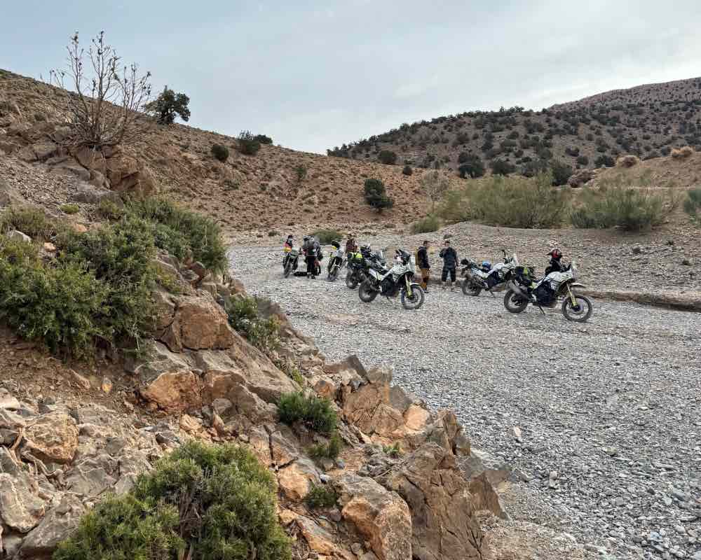 Blog: Scouting 4. Ollie Moto and the Wheels of Morocco crowd taking a rest in a riverbed.